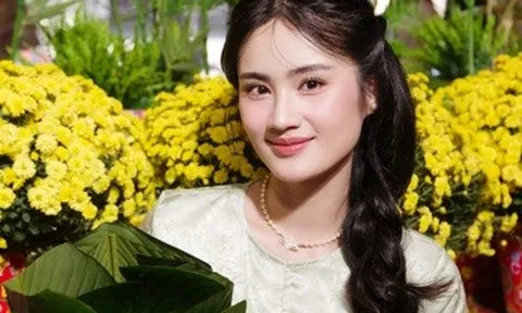 Ý Nhi từ Australia về Việt Nam đón Tết, diện áo bà ba gói bánh chưng